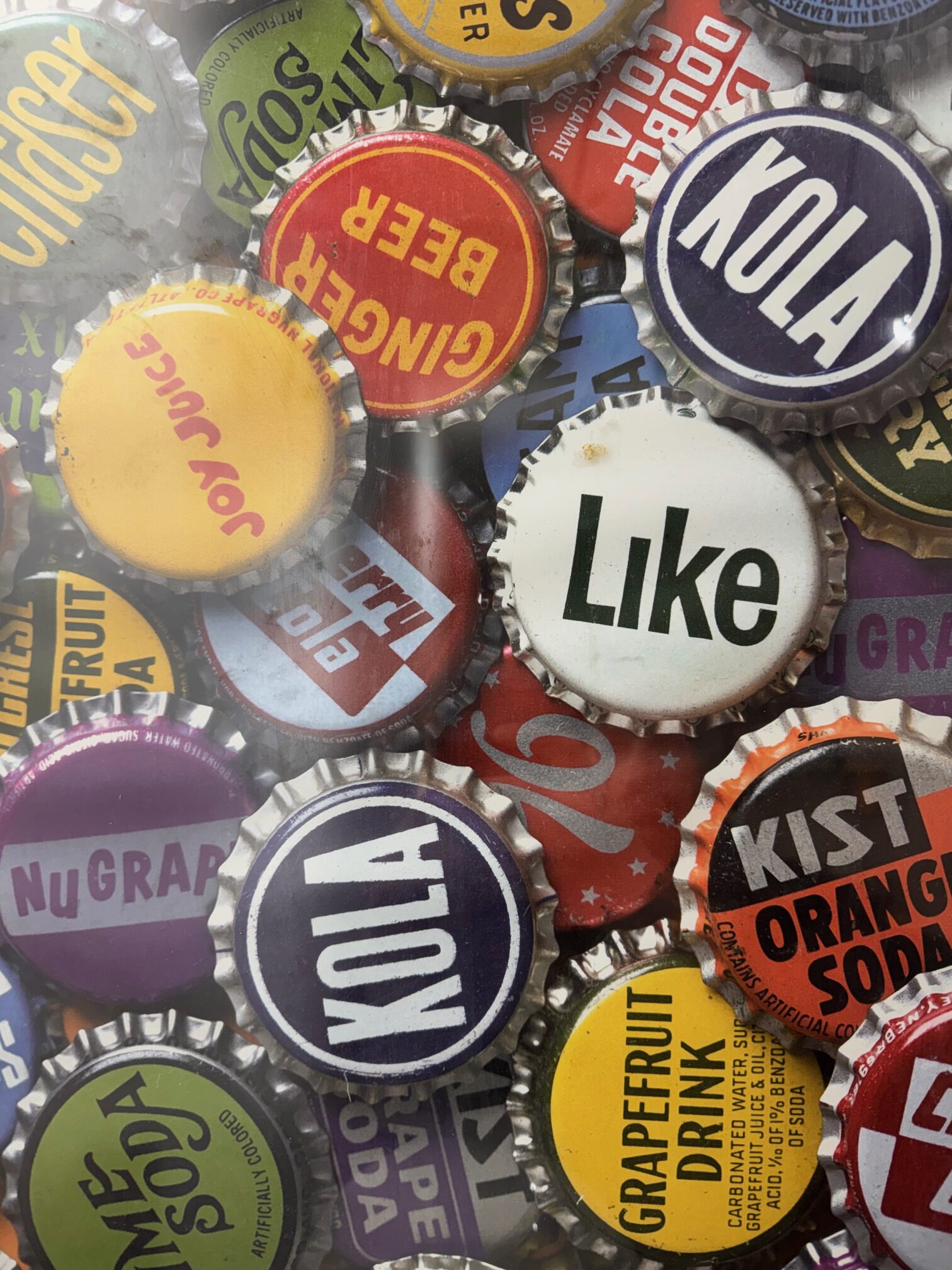 Collection of colourful vintage soft drink bottle caps
